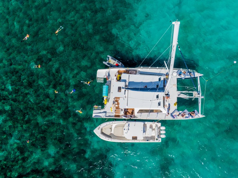 Aerial view of a catamaran and another small boat in the ocean